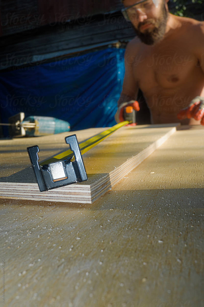 Plywood Measuring By Construction Tape