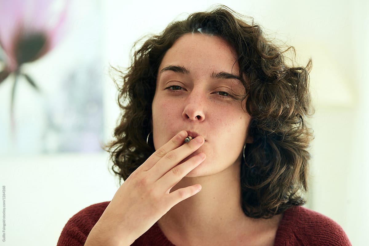 Smoking Woman Looking At Camera By Stocksy Contributor Guille Faingold Stocksy