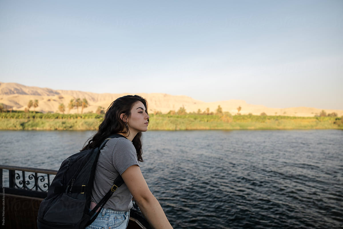 A woman enjoying on a cruise along the Nile River