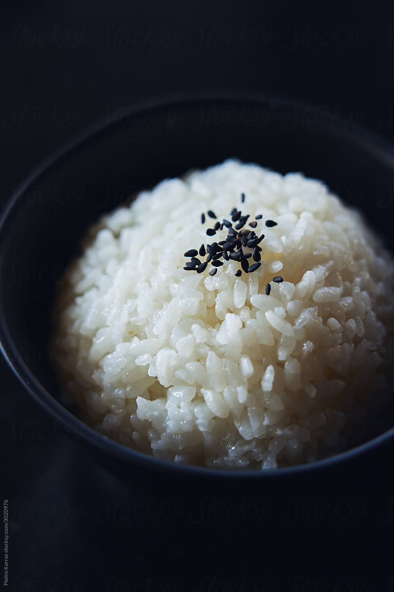 Portion o boiled rice with sesame