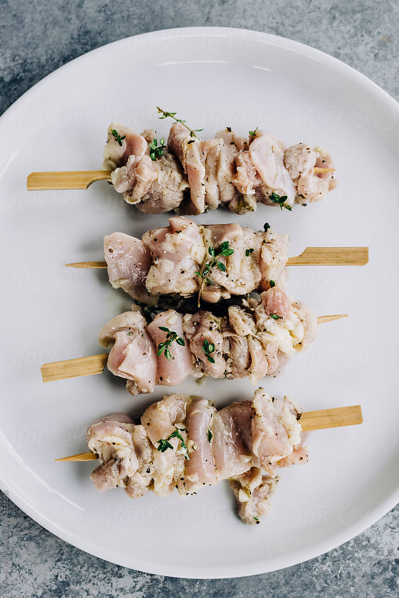 Raw chicken skewers marinated with lemon thyme marinade