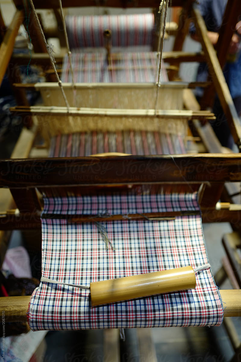 Chinese ancient looms are wrapped with cotton thread