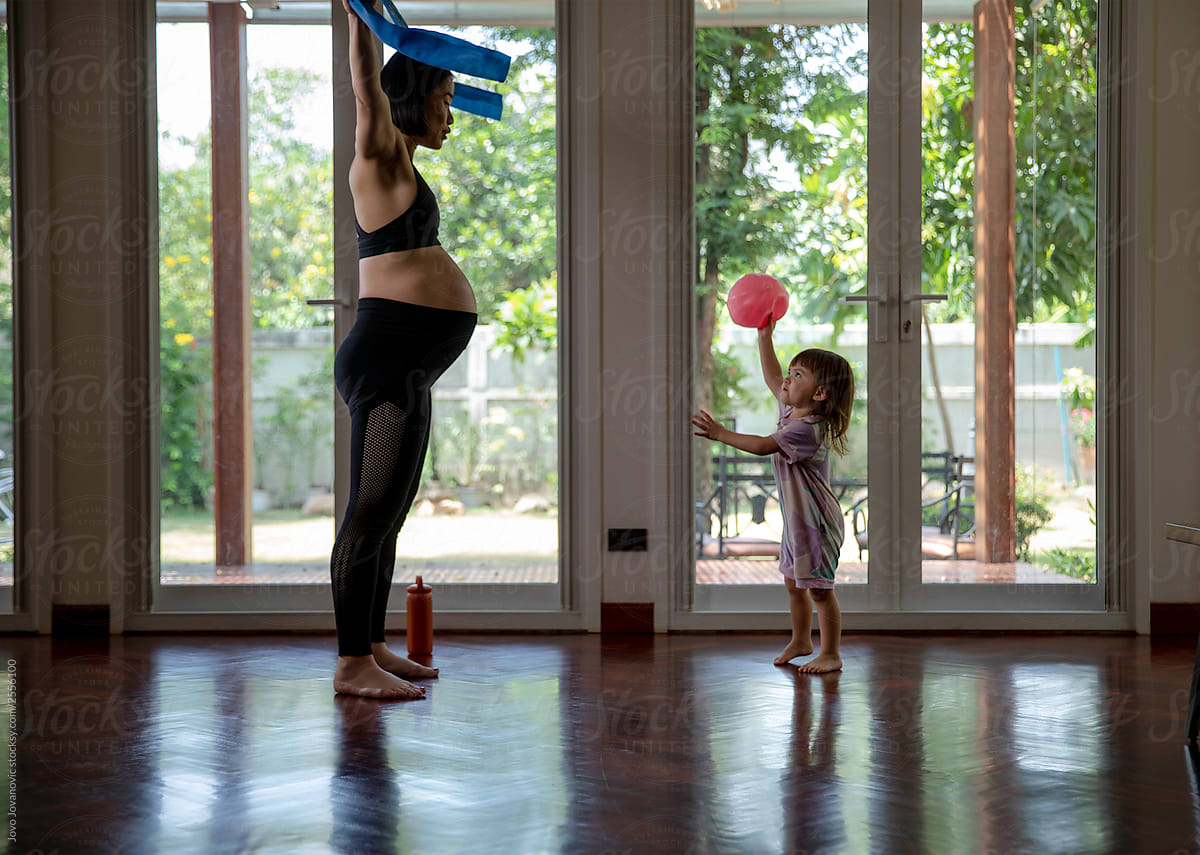 Mom and daughter doing small exercise at home