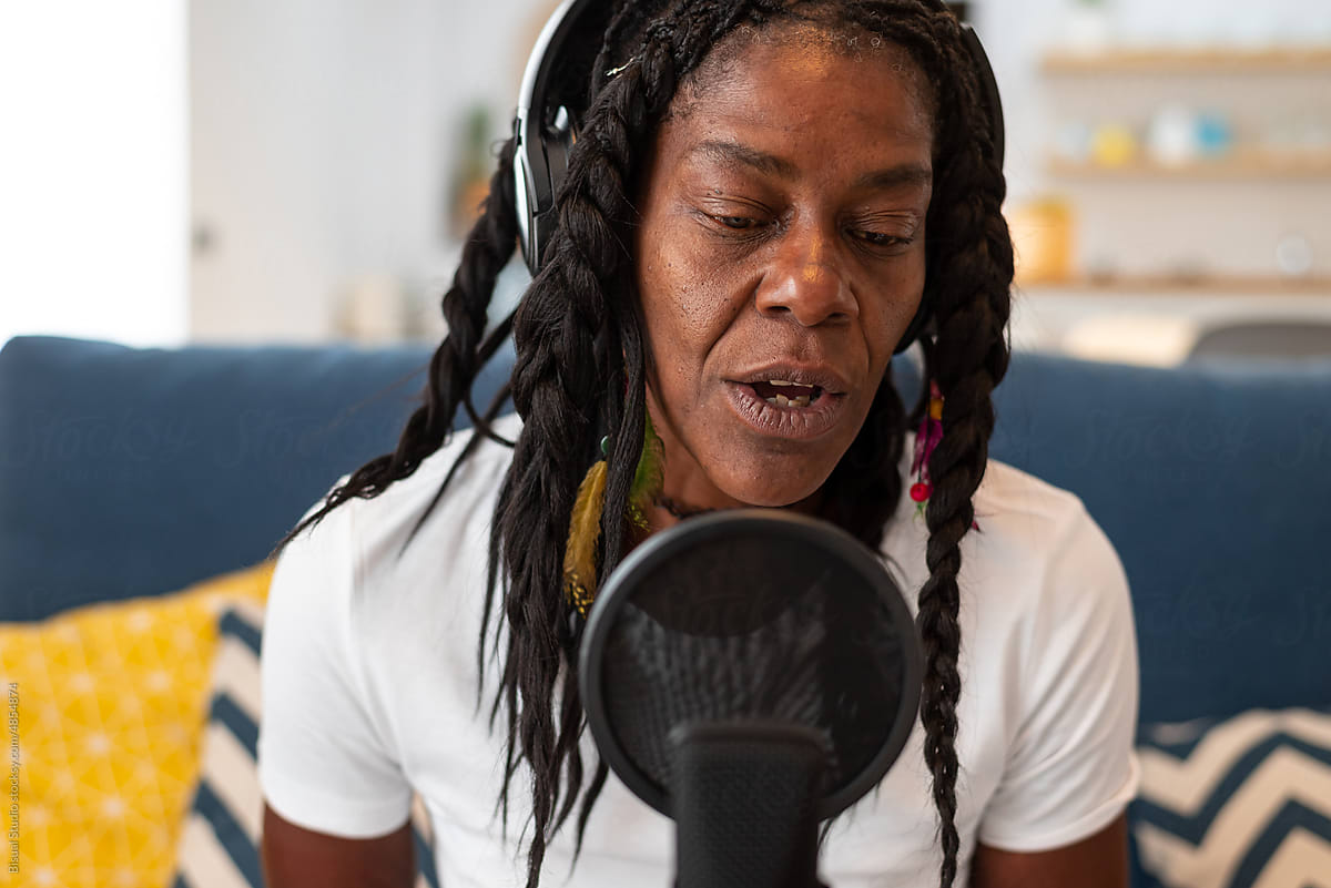 Black woman singing at home