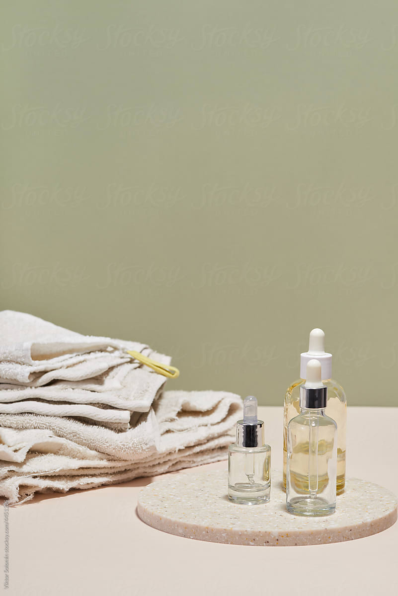 Bottles of skin care products and towels