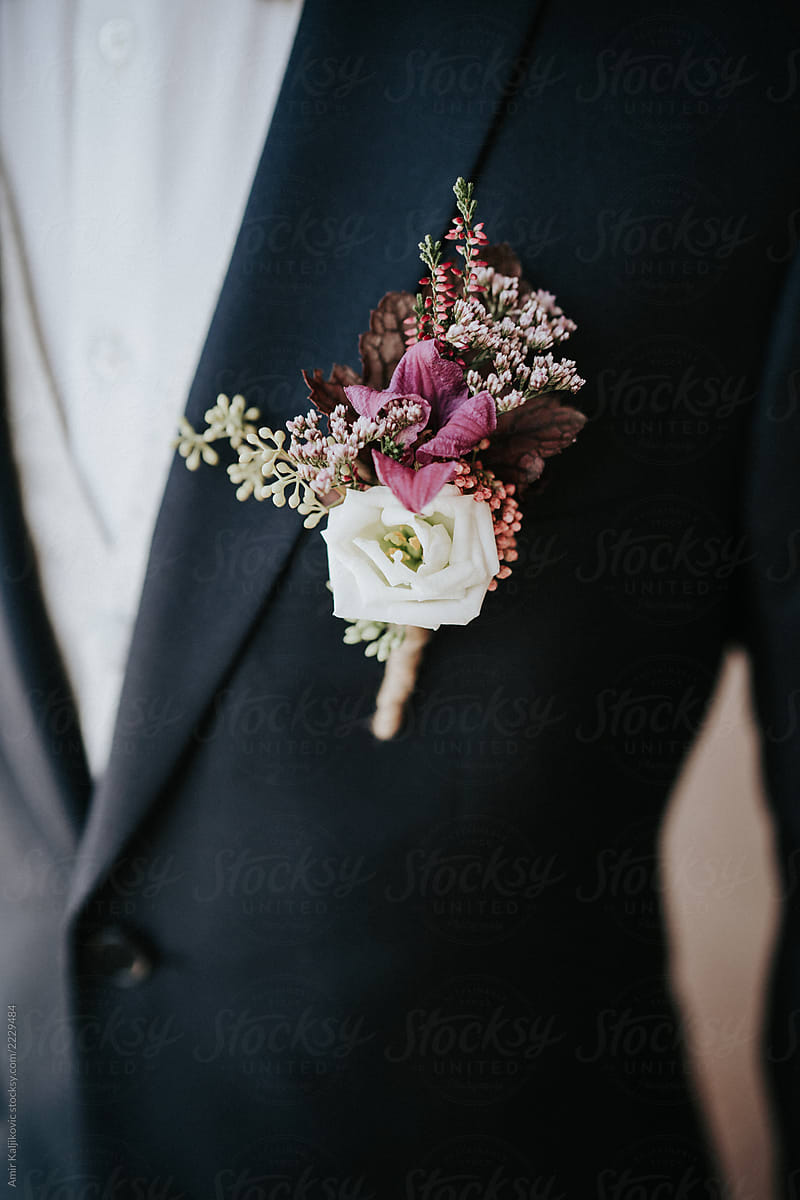 Bride groom or best man wearing a floral corsage