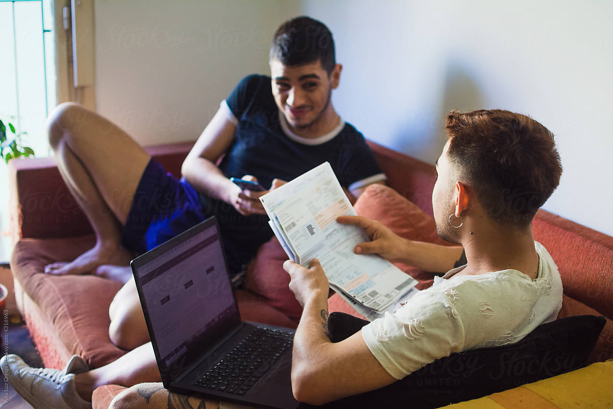 Gay couple paying bills online