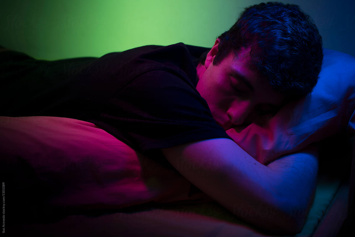 Sleeping hugging the pillow with neon lighting