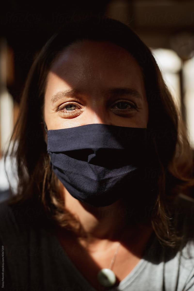 Portrait of a woman on the tram wearing a covid mask