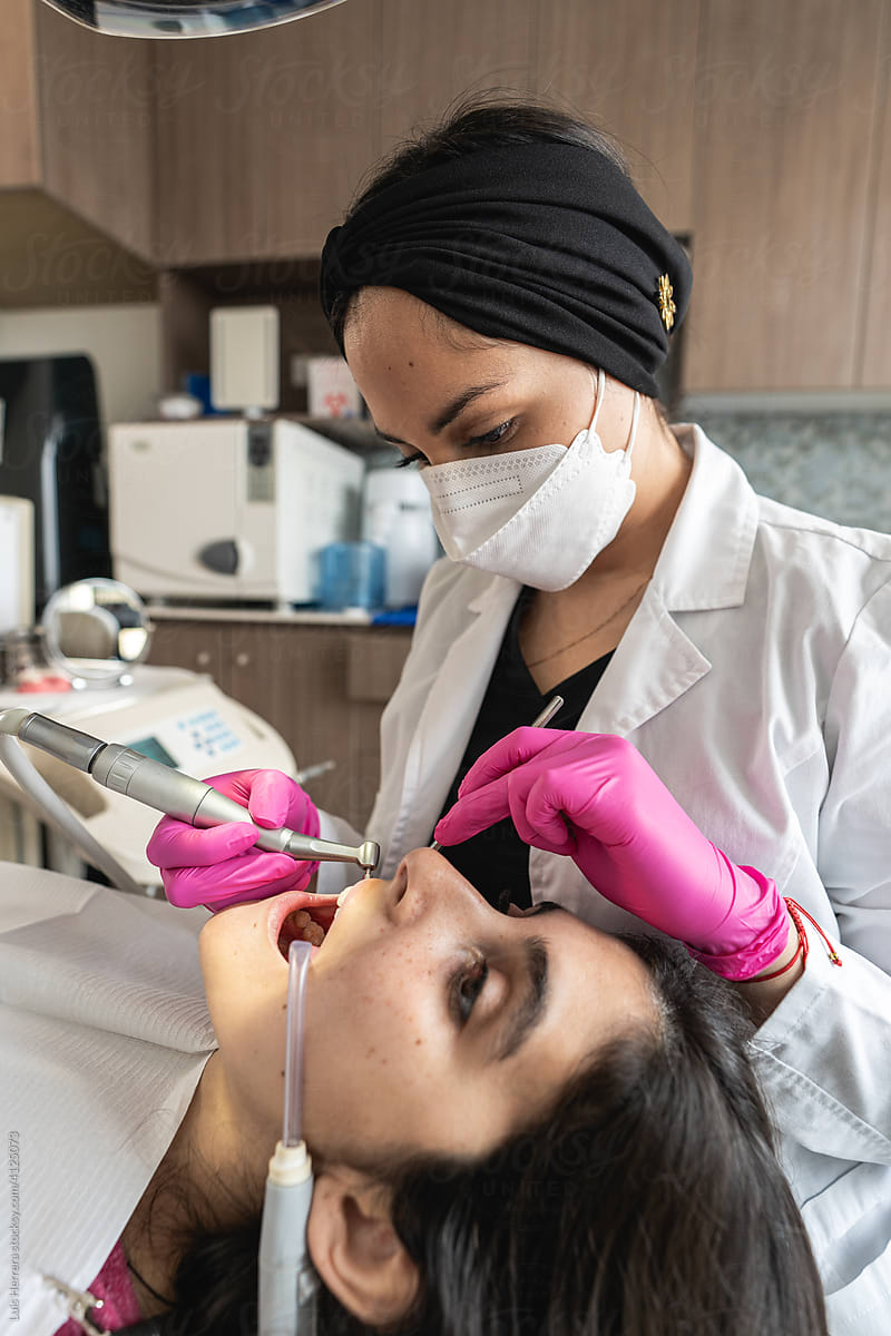 woman dentist treating a patient