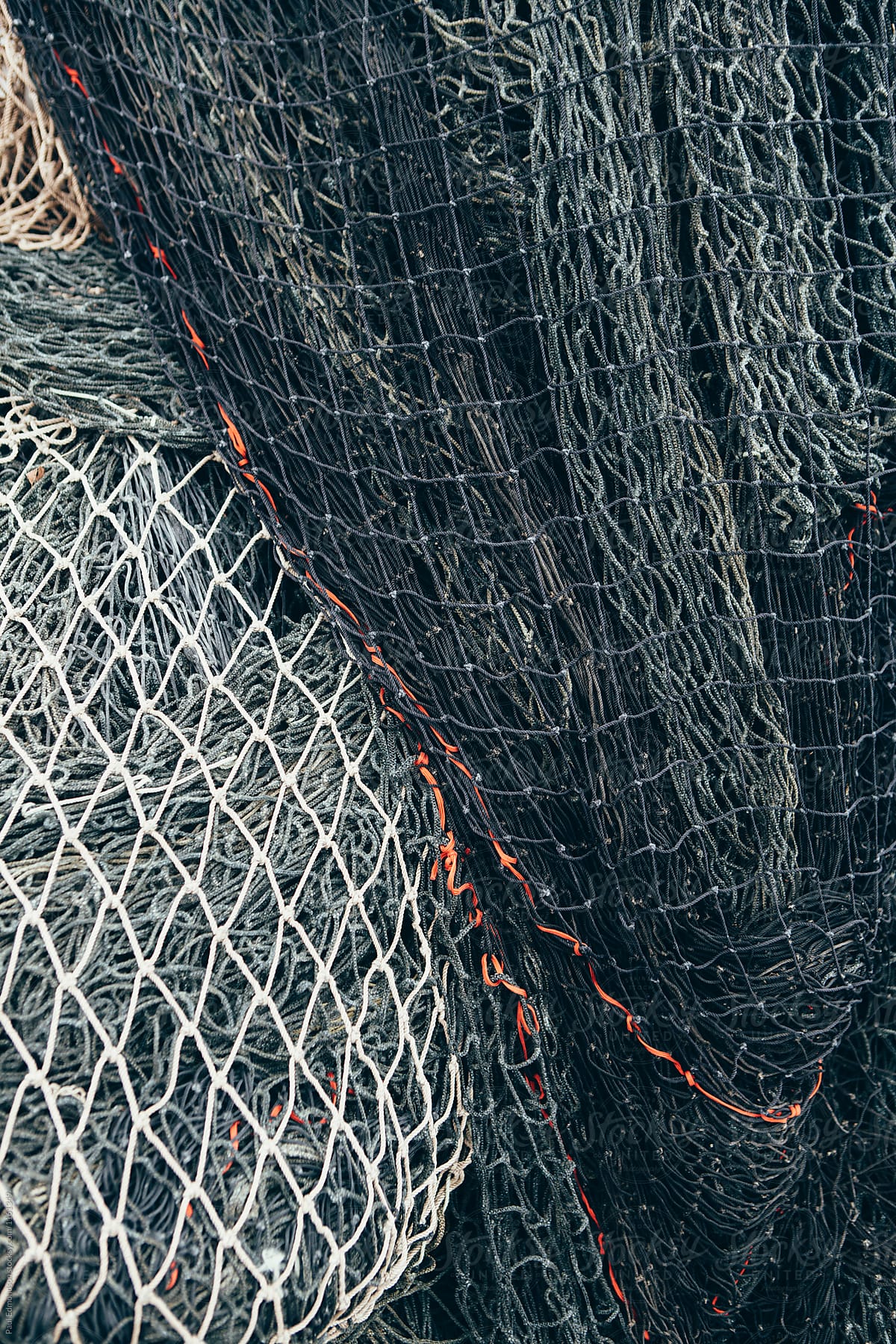 Blue Tarpaulin Covering Pile Of Commercial Fishing Nets by Stocksy  Contributor Rialto Images - Stocksy