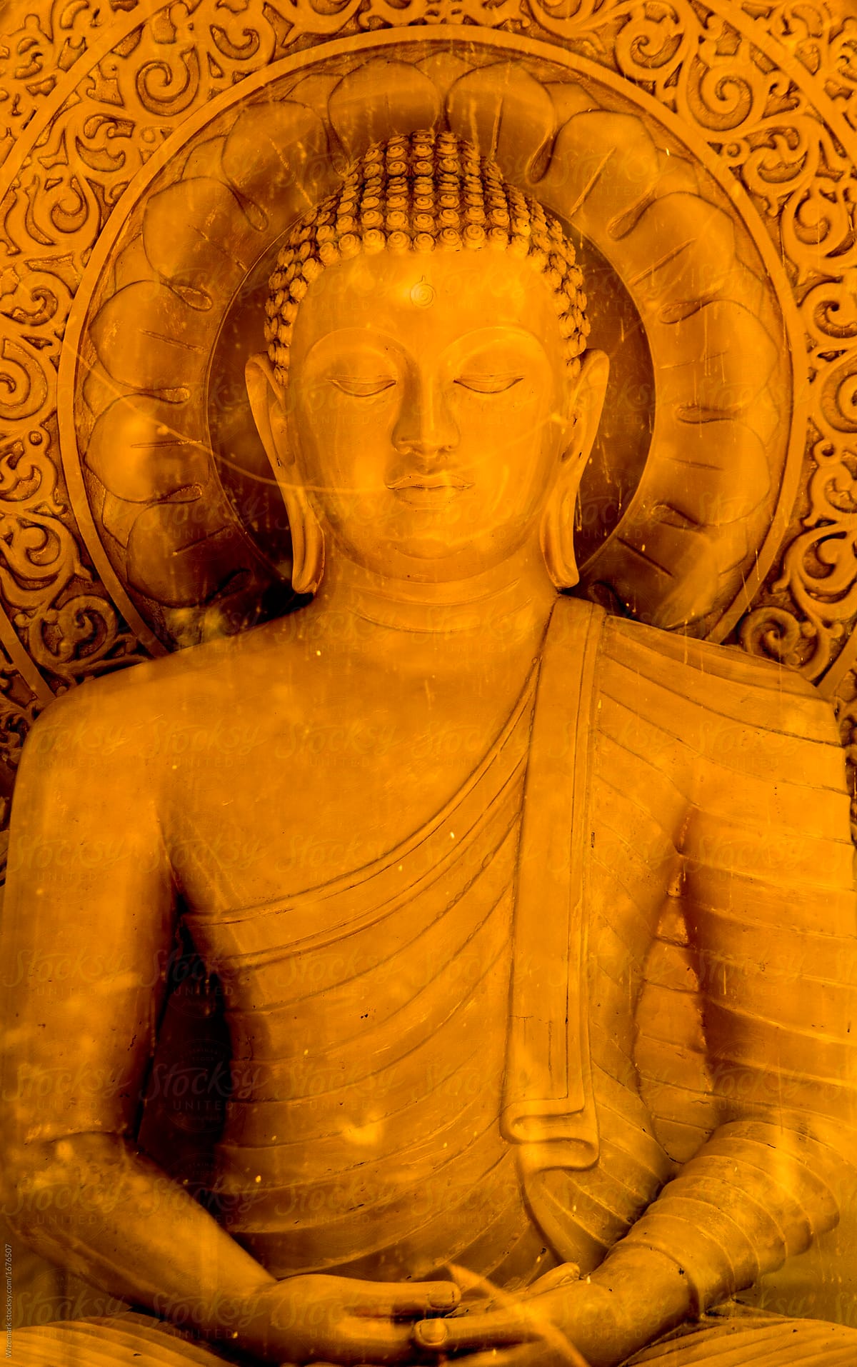 golden meditating Buddha sculpture