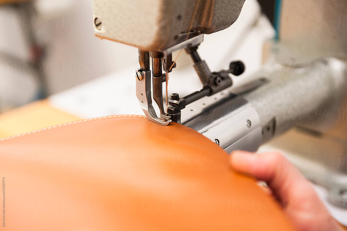 Detail of leather sewing at handbag workshop