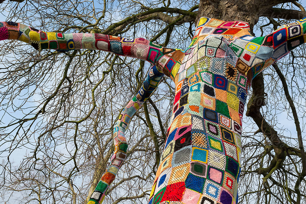 Top of a Yarn bombed tree. Tree covered with knitted wool yarn.