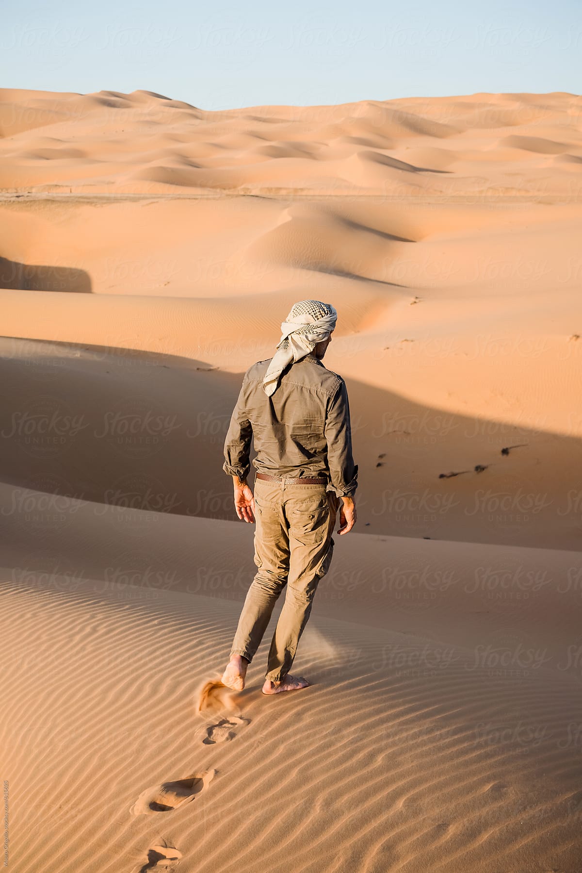 Man walks in the desert