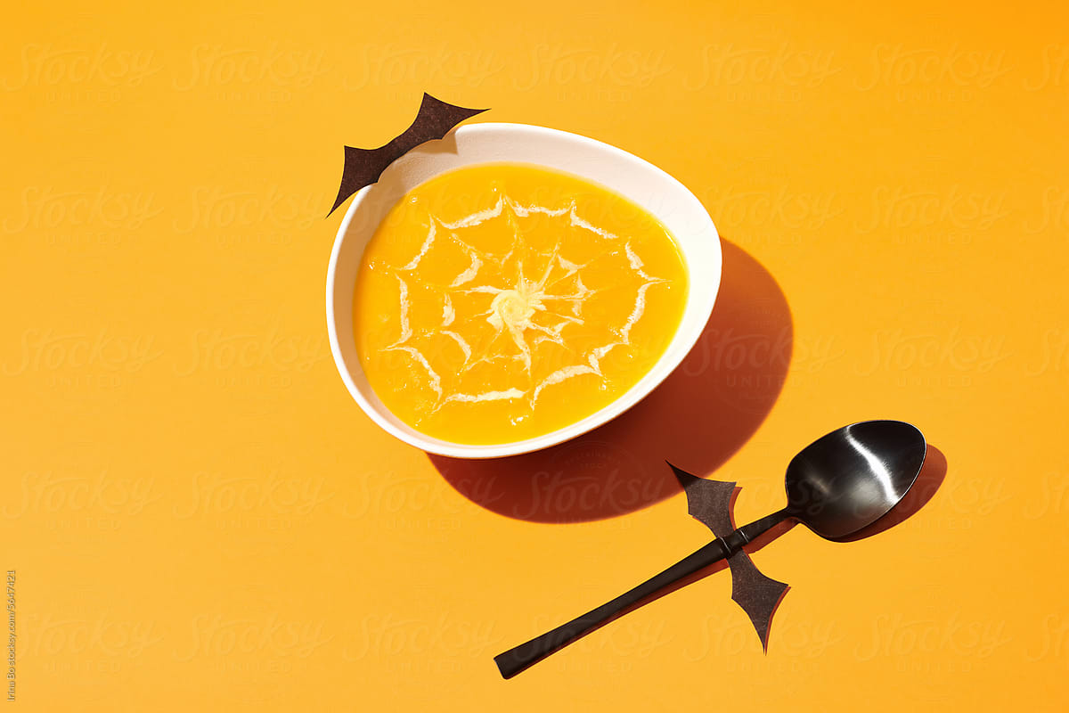 bowl of pumpkin soup decorated for Halloween