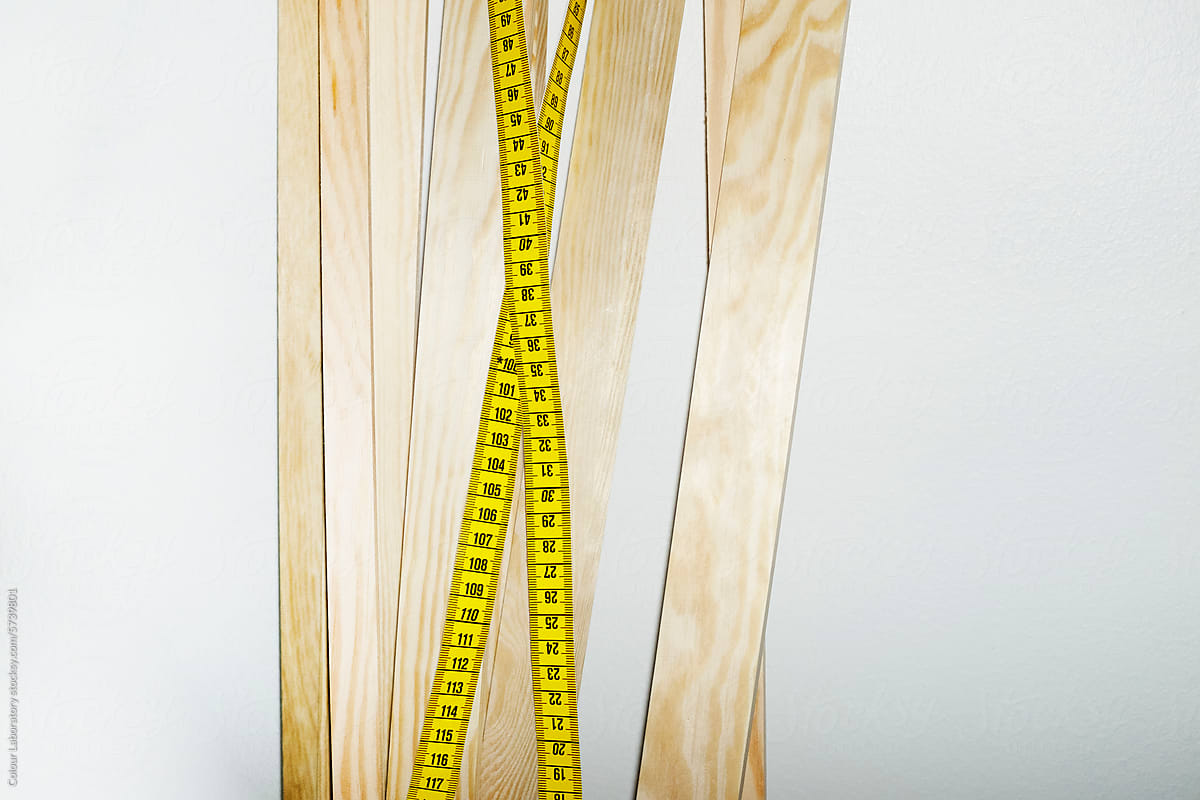 Wood sticks and measuring tape with hard direct flashlight
