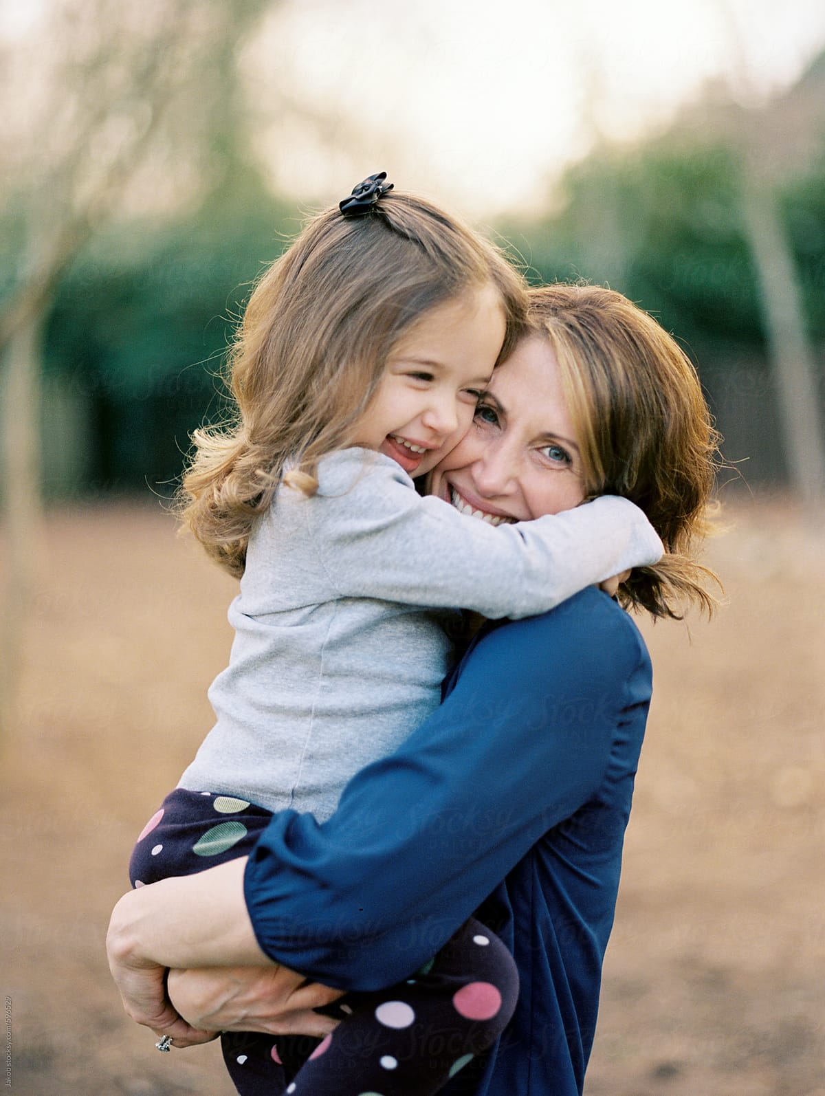 Mother And Daughter Hugging By Stocksy Contributor Jakob Lagerstedt