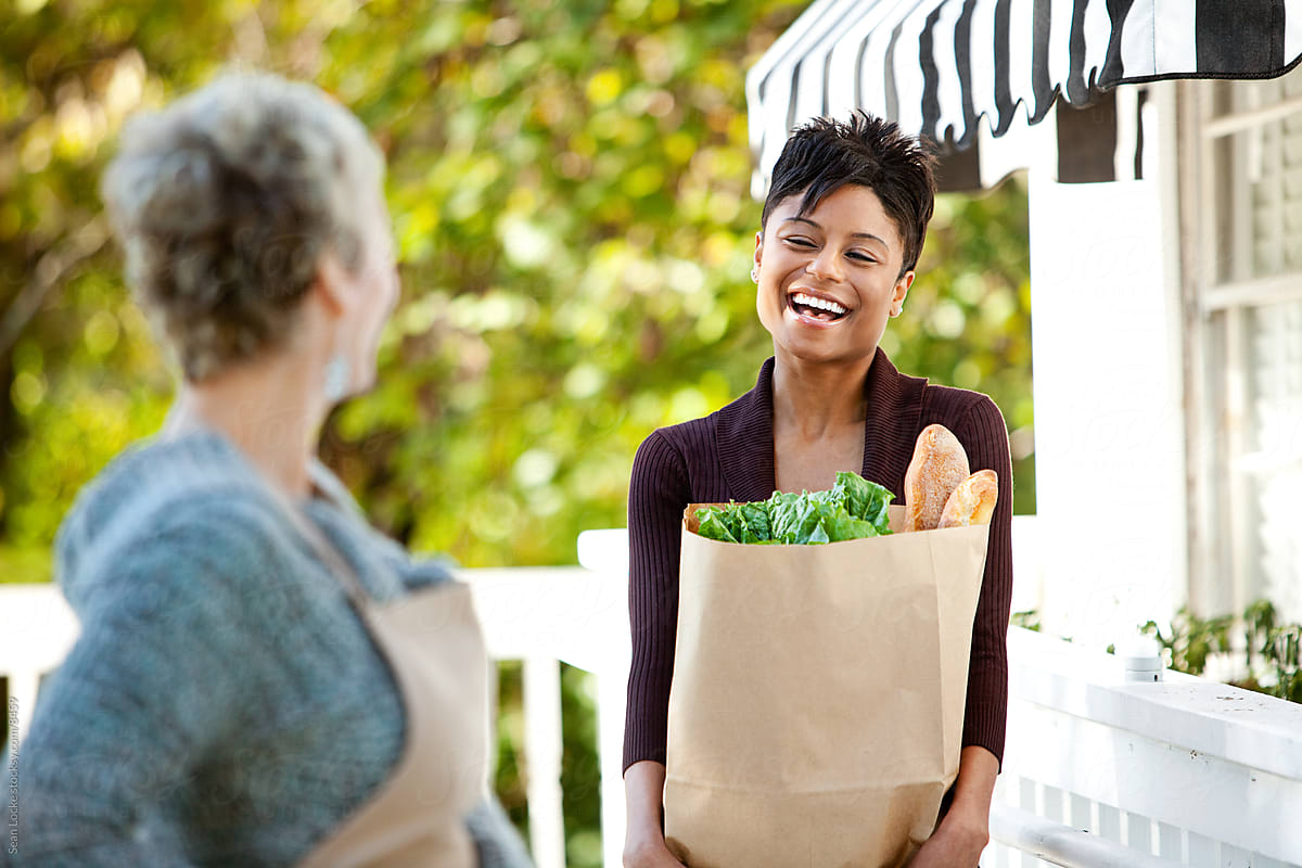 Shop: Customer Carries Bag of Groceries