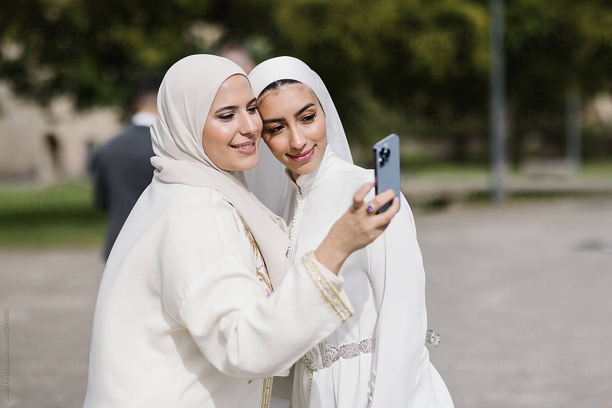 Young bride in wedding dress selfie