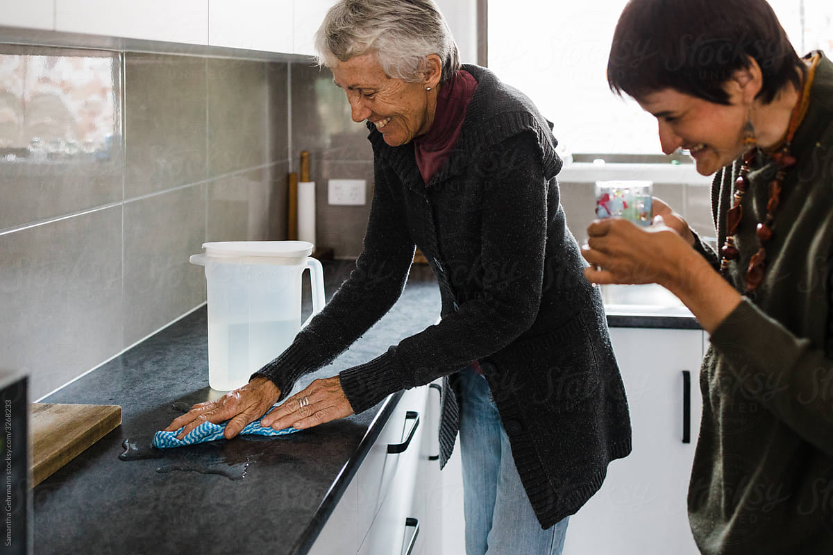 Elderly mother cleaning up mess