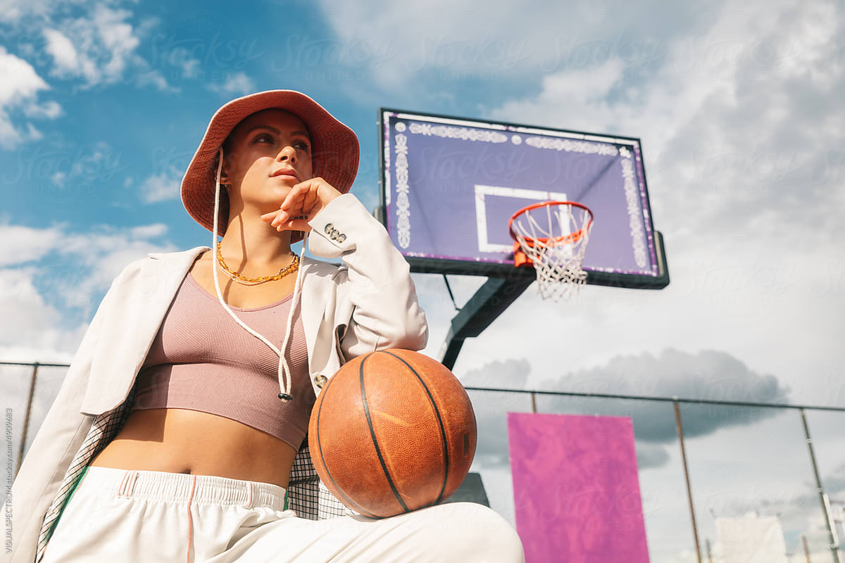 Fashionable Young Woman Posing on Basketball Court