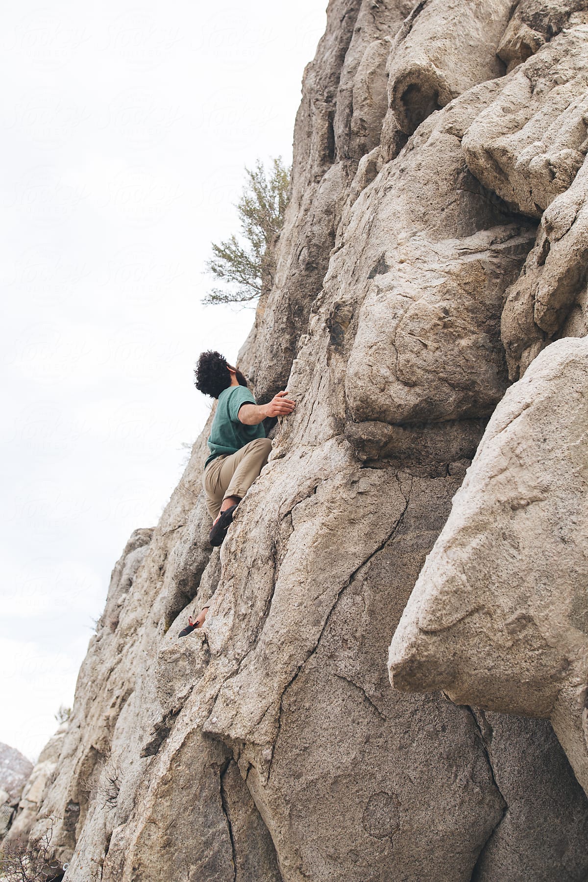 Man Rock Climbing in Utah