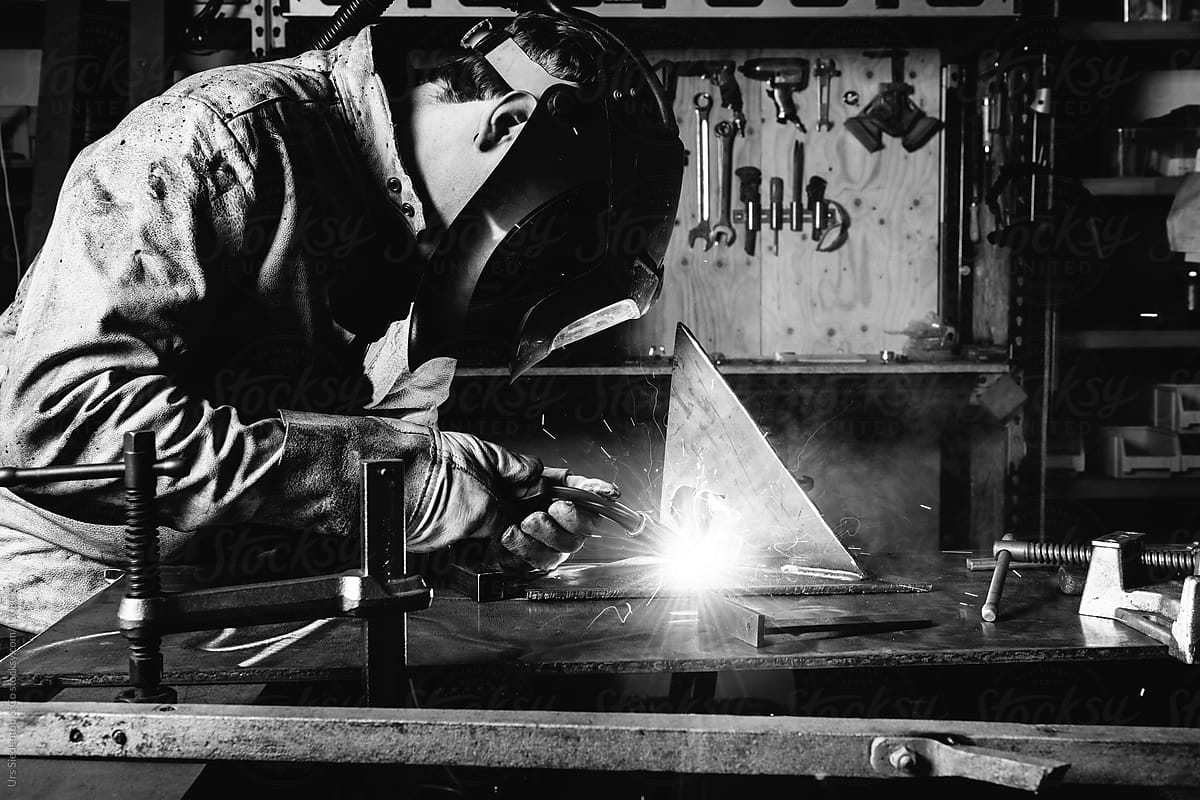 Black and white image of welder welding