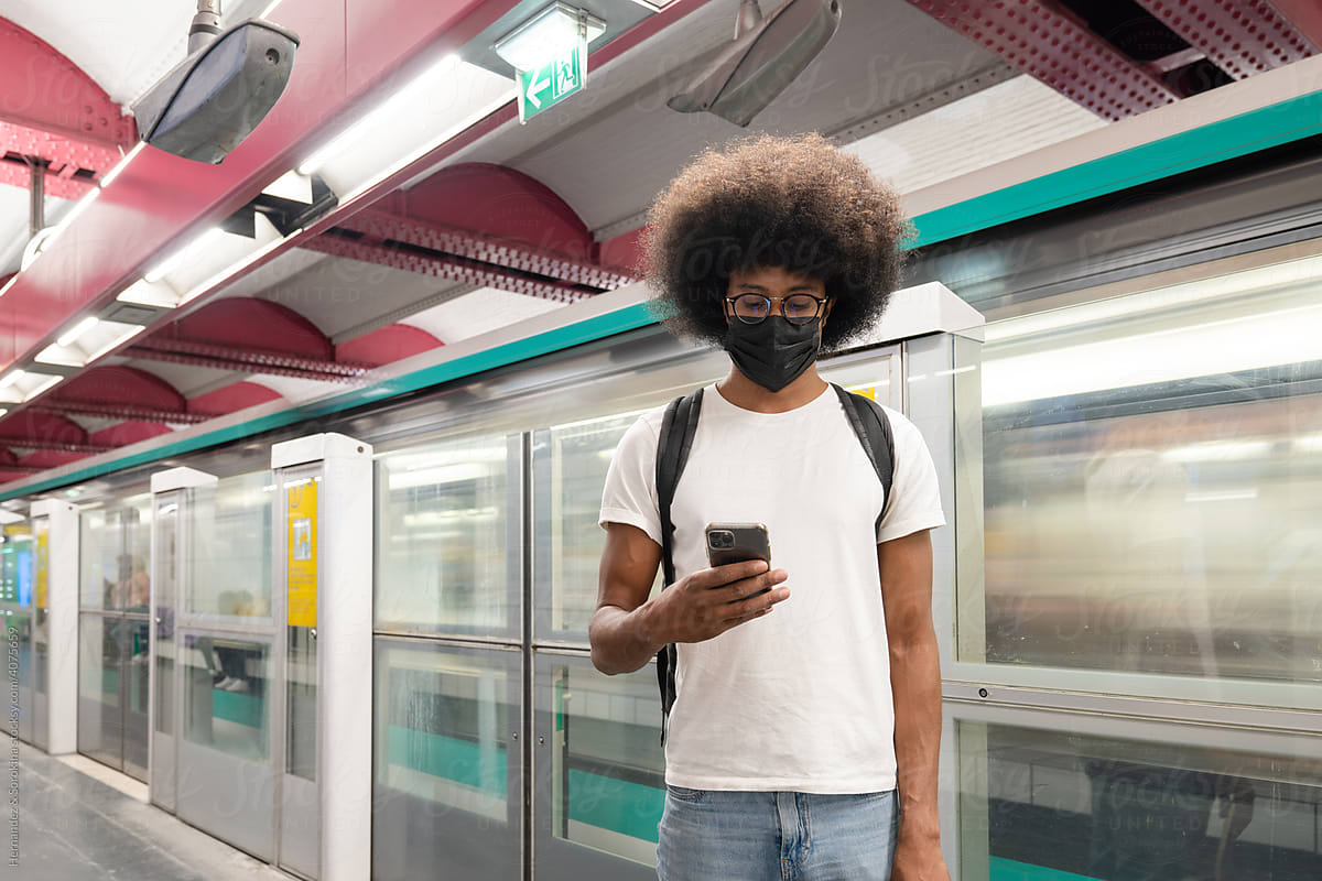 Man Using Phone At Subway Station