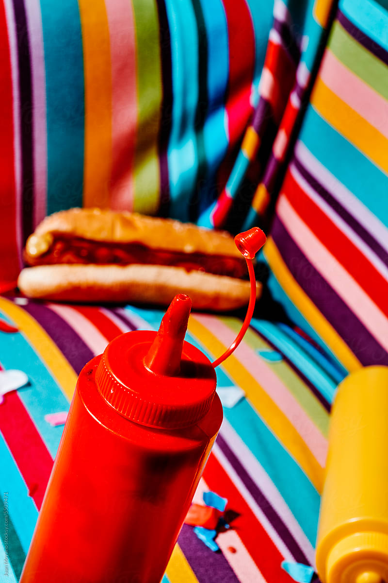 ketchup, mustard and hotdog on an armchair