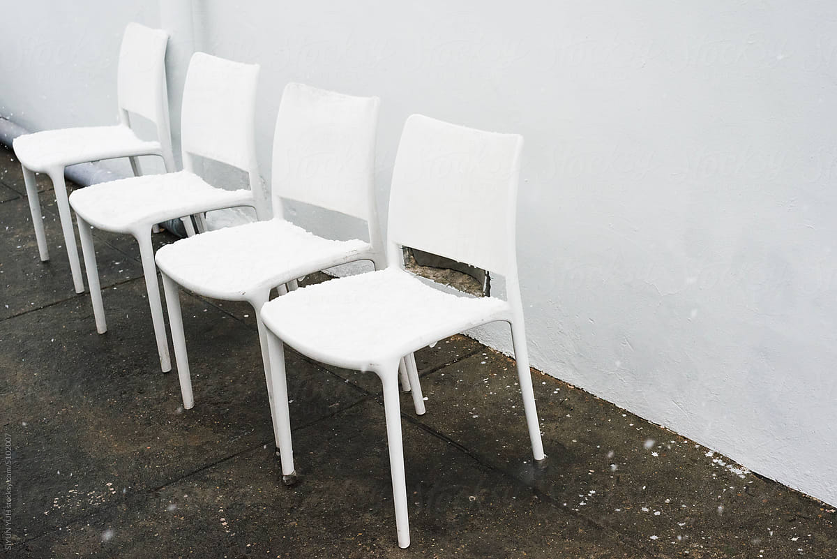 White chairs on the pavement