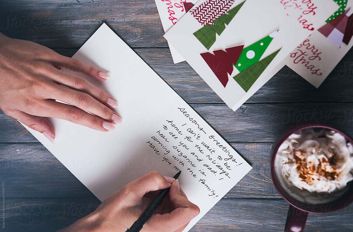 Christmas: Woman Writing Christmas Note To Family