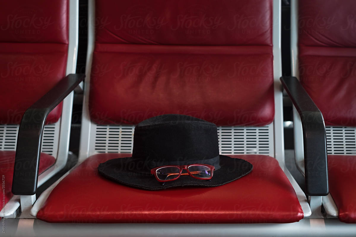 Hat and glasses on couch