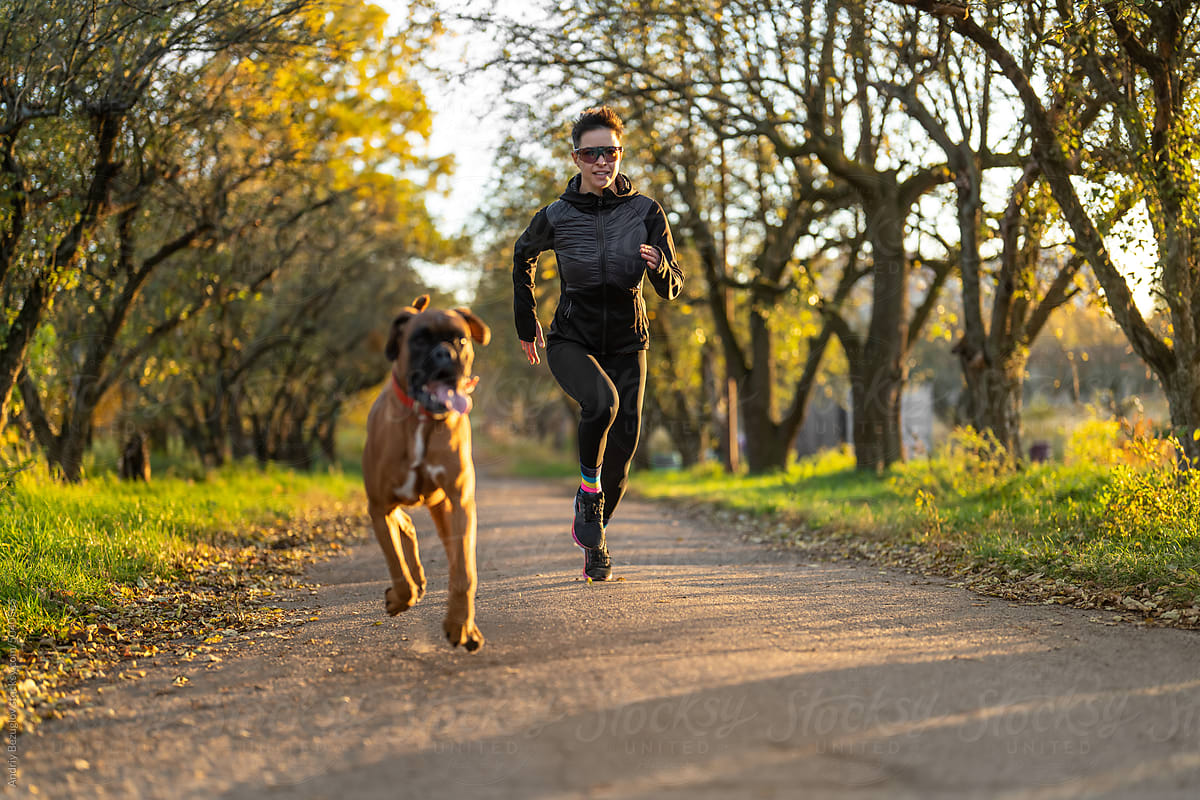 Outdoor run of woman and her dog