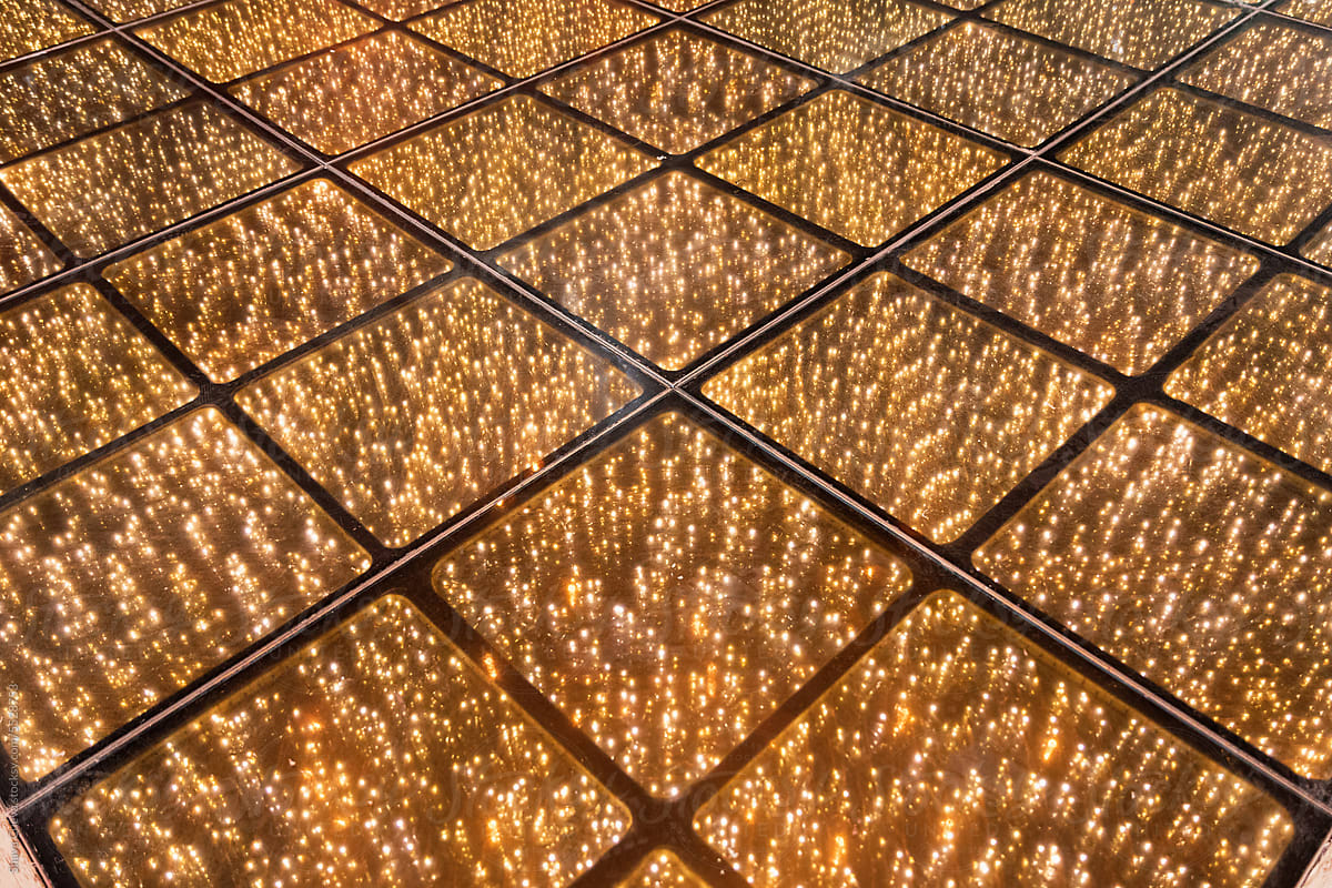 Party floor illuminated with golden lights