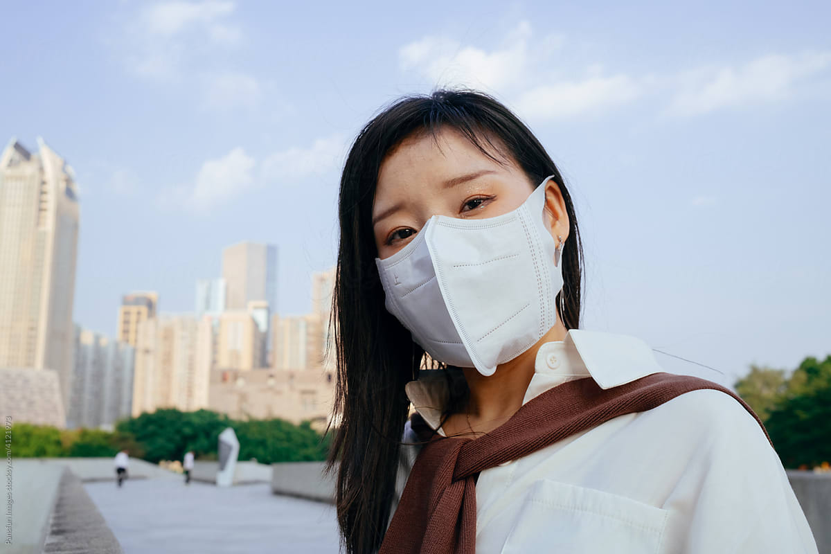 Asian female wearing a protective mask
