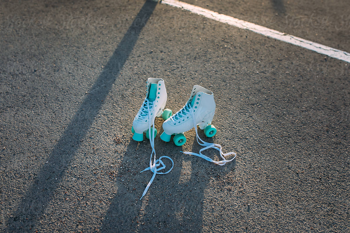 Roller skates on the asphalt in sunset light