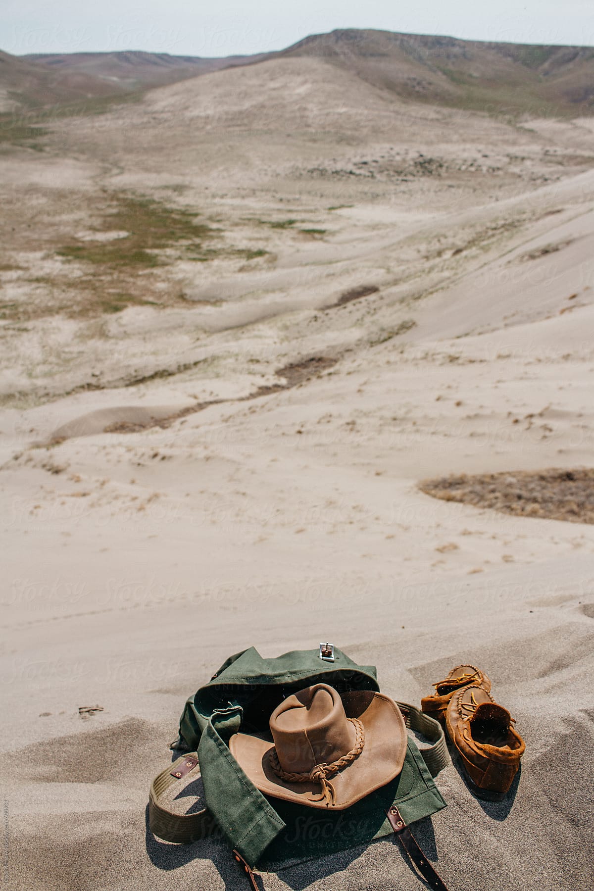 hiking pack laying in sand during adventure