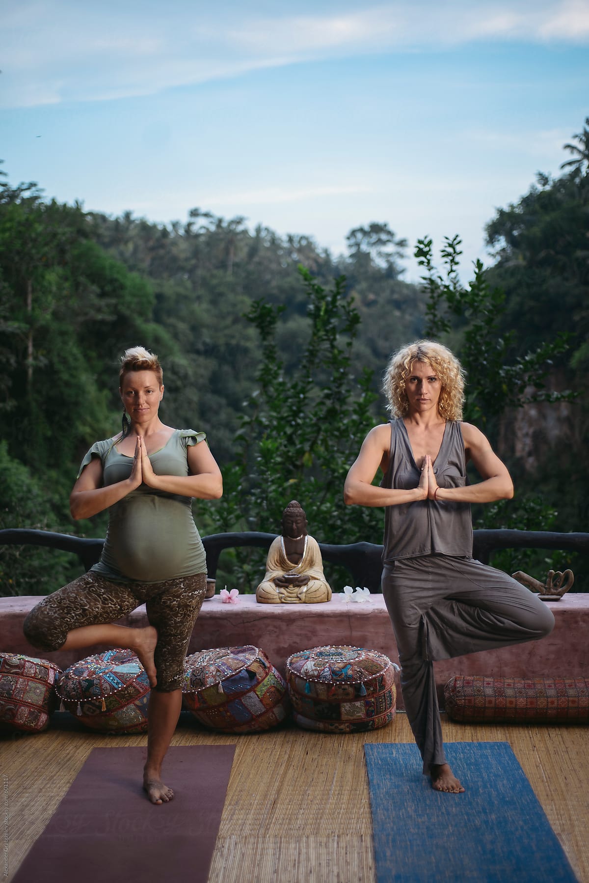 Pregnant Woman Doing Yoga Class With A Teacher