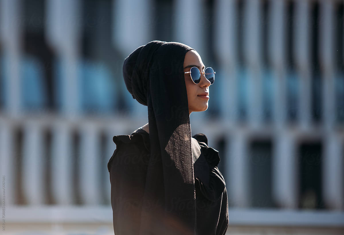 Modern woman in headscarf and sunglasses
