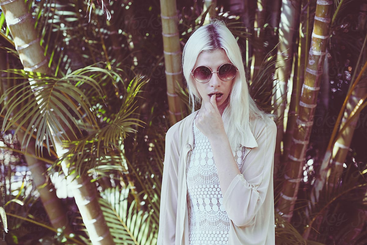 blonde girl in tropical garden