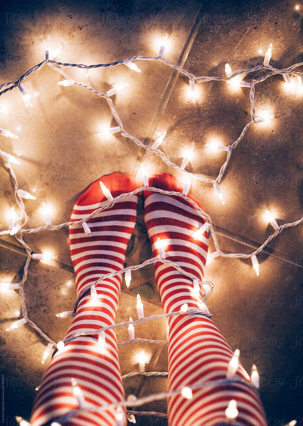 Striped knee high socks and Christmas lights