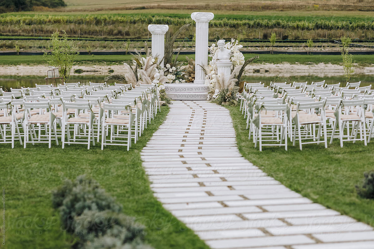 Wedding ceremony event outdoor white chairs