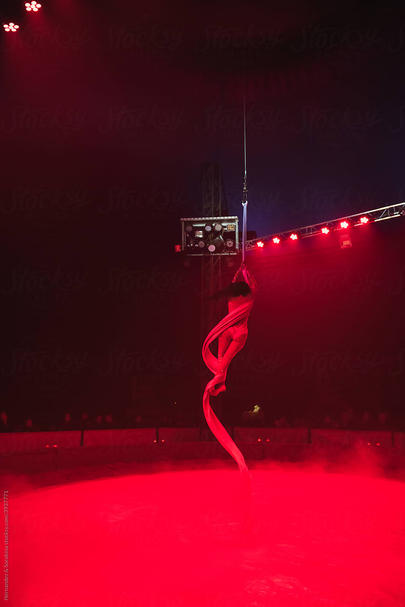 Graceful Gymnast Performance In Red Lights