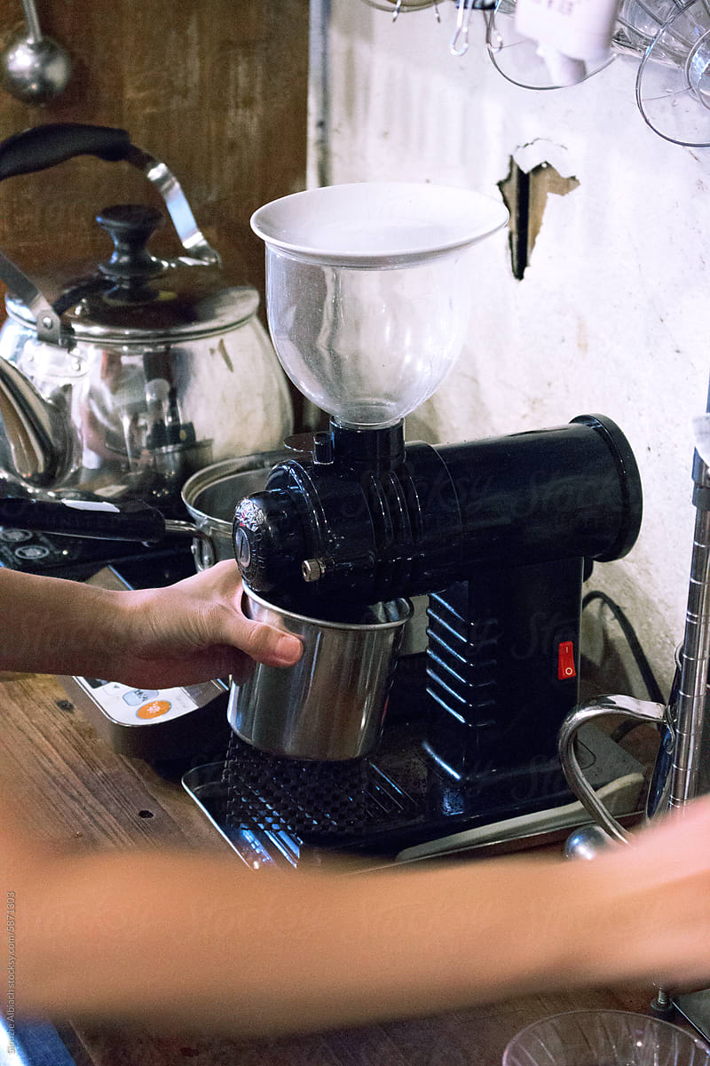 Barista grinding coffee beans in a Japanese coffee shop in Kyoto