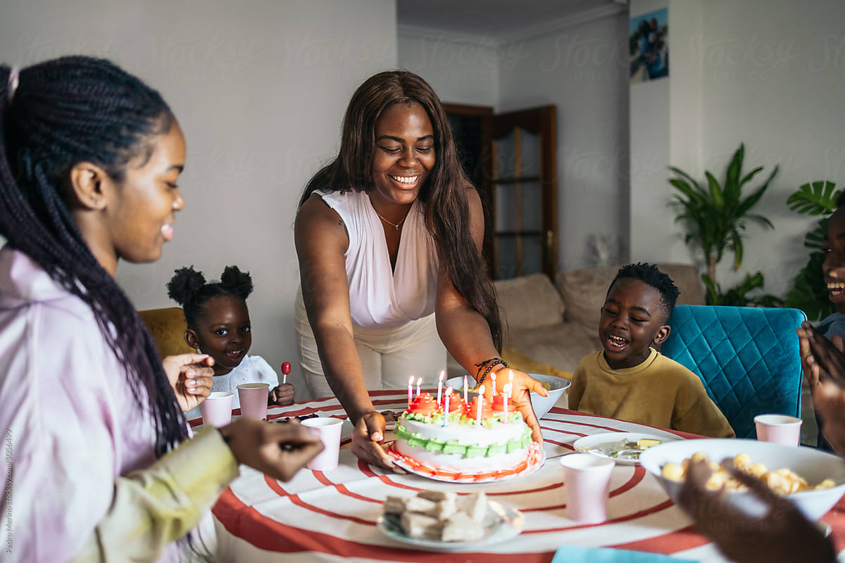 Black family celebrating a birthday at home