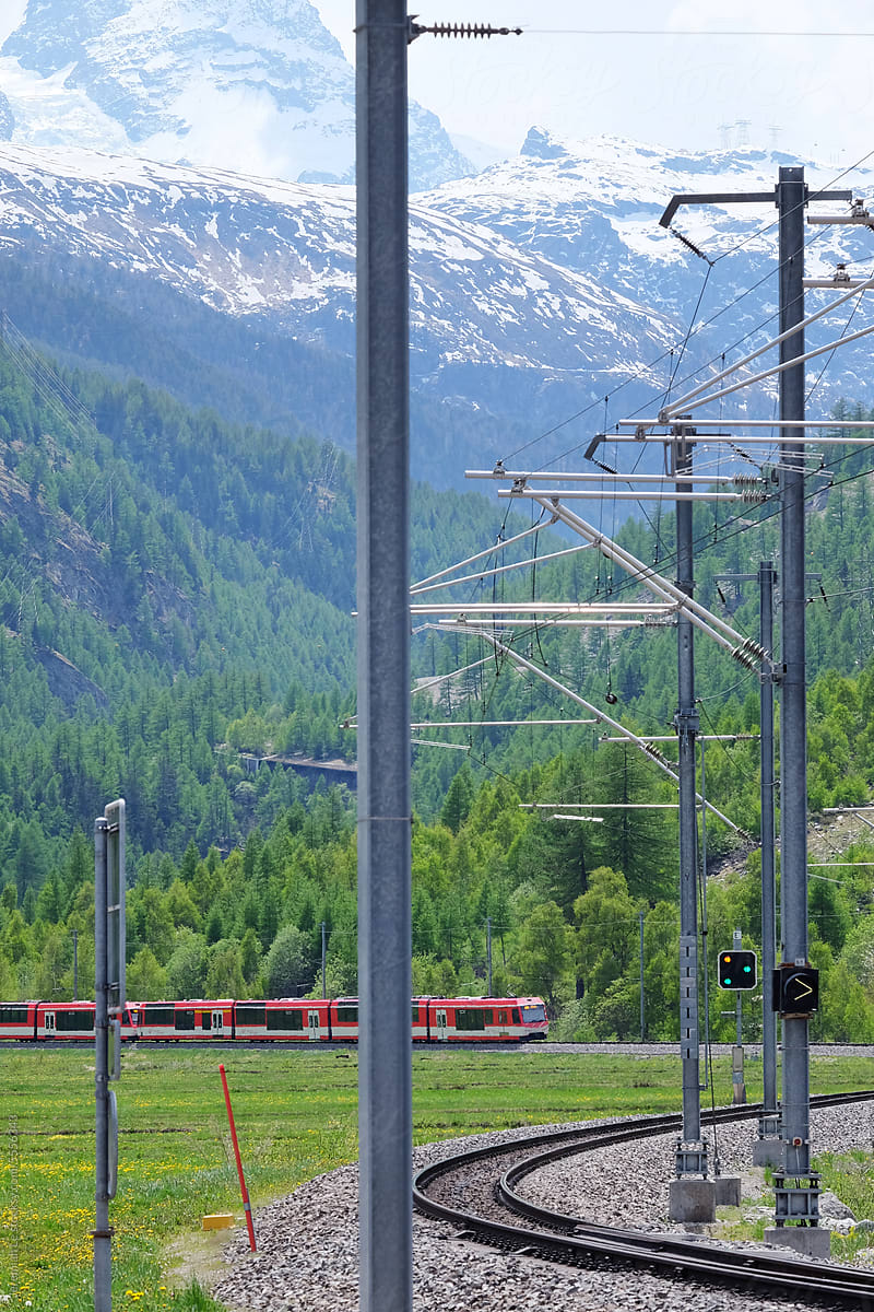 Red Train in a green Valley in Switzerland