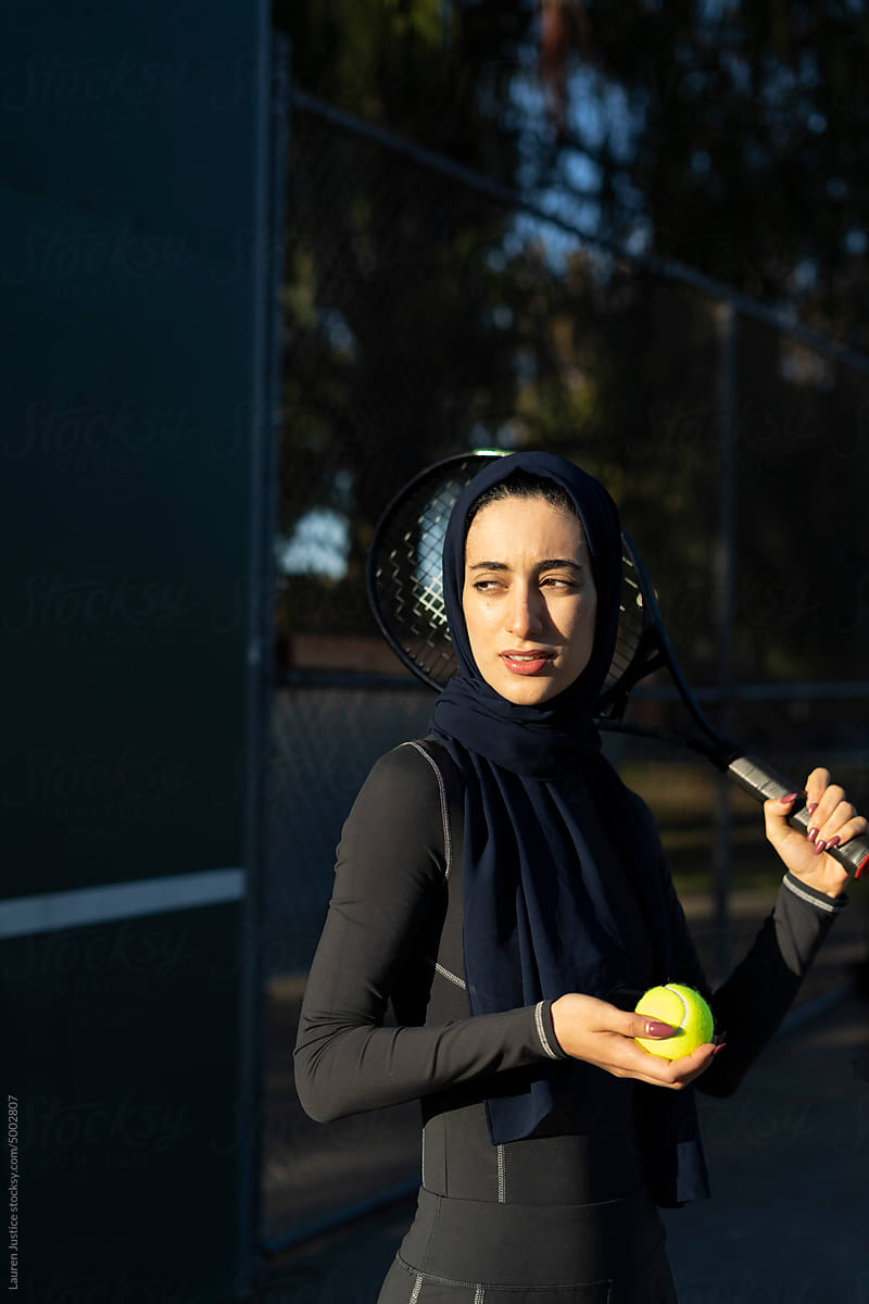 Sunrise tennis portrait in hijab