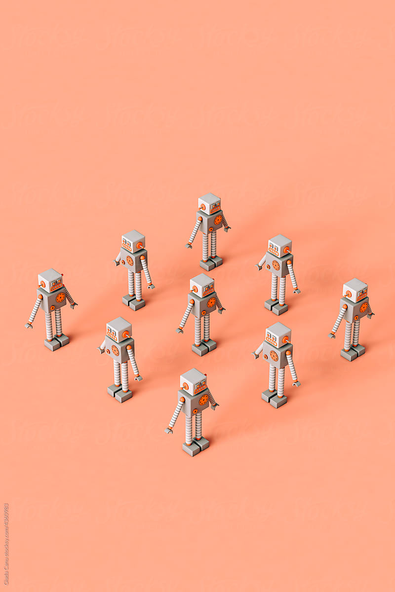 Toy robots forming a square on a pink background