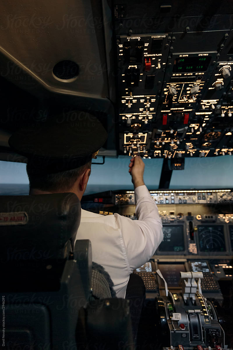Pilot in cockpit preparing for flight